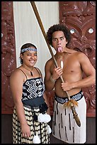 Maori woman and man sticking out his tongue. Polynesian Cultural Center, Oahu island, Hawaii, USA (color)