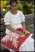 Woman making a traditional hawaiian quilt. Polynesian Cultural Center, Oahu island, Hawaii, USA (color)