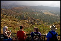 Tourists look at the  Diamond Head crater, early morning. Oahu island, Hawaii, USA ( color)