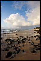 Boulders, coastline, and clouds, Lydgate Park, sunrise. Kauai island, Hawaii, USA (color)