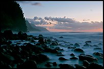 Boulders, surf, and Na Pali Coast, Kee Beach, dusk. Kauai island, Hawaii, USA (color)