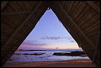 Aiopio fishtrap framed by Halau at dusk, Kaloko-Honokohau National Historical Park. Hawaii, USA (color)