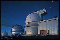 Telescopes and stars at nightfall. Mauna Kea, Big Island, Hawaii, USA