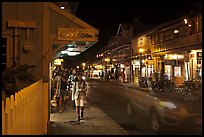 Tourists strolling store-lined street at night. Lahaina, Maui, Hawaii, USA ( color)