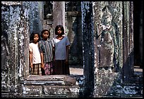 Girls in temple complex, the Bayon. Angkor, Cambodia