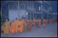 Morning alms procession of buddhist monks. Luang Prabang, Laos