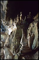 Buddhist statues left by pilgrims, lower Pak Ou cave. Laos (color)