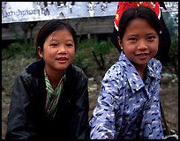 Two young girls at the market. Luang Prabang, Laos (color)