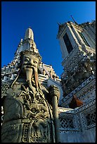 Statue and tower, Wat Arun. Bangkok, Thailand (color)