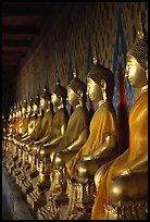 Row of Buddha statues in gallery, Wat Arun. Bangkok, Thailand (color)