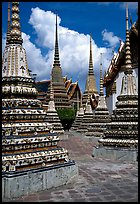 Layered and streamlined chedis in Ratanakosin style, Wat Pho. Bangkok, Thailand (color)