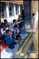 Worshipers at Wat Phra That Doi Suthep, the North most sacred temple. Chiang Mai, Thailand (color)