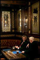 Business men talking over a beer, Victorian boozer Princess Louise. London, England, United Kingdom (color)