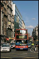 Double decker busses in a busy street. London, England, United Kingdom (color)