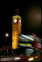 Double-decker bus in motion and Big Ben at night. London, England, United Kingdom