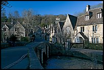 Packbridge crossing the Bybrook River and main street, Castle Combe. Wiltshire, England, United Kingdom