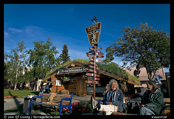 Native people sitting in front of visitor center. Anchorage, Alaska, USA