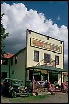 Ma Johnson hotel with classic car parked by, afternoon. McCarthy, Alaska, USA