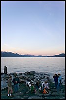 Family enjoying midnight picknik, Resurrection Bay, sunset. Seward, Alaska, USA ( color)