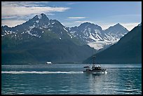 Fishing boat, mountains and glaciers. Seward, Alaska, USA