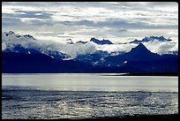 Low clouds haning over Kenai Mountains across Katchemak Bay. Homer, Alaska, USA