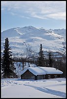Snowy cabin and mountains. Wiseman, Alaska, USA (color)
