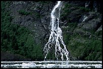 Waterfall dropping into the sea. Prince William Sound, Alaska, USA
