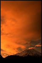 Clouds dramatically colored at sunset above Mt Shasta. California, USA