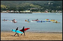 Surfers and sea kayakers, Pillar point harbor. Half Moon Bay, California, USA ( color)