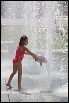 Girl refreshing herself, Cesar de Chavez Park. San Jose, California, USA (color)