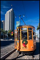 Historic trolley car and Embarcadero center building. San Francisco, California, USA (color)