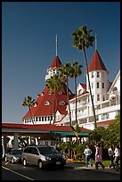 Entrance of hotel del Coronado, with cars and tourists walking. San Diego, California, USA ( color)