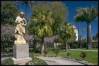 Statue, palm trees, and mission, Santa Clara University. Santa Clara,  California, USA ( color)