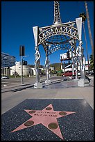 Star from the Hollywood walk of fame and gazebo with statues of actresses. Hollywood, Los Angeles, California, USA (color)