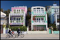Family cycling in front of colorful beach houses. Santa Monica, Los Angeles, California, USA ( color)