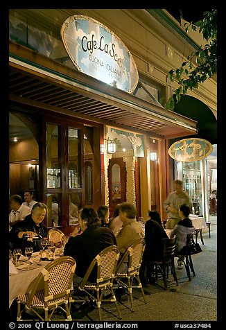 Italian restaurant with diners by night. Burlingame,  California, USA (color)