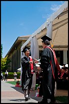 Student receiving handshake prior diploma award. Stanford University, California, USA (color)