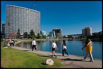People strolling around 3.5 mile path around Lake Merritt. Oakland, California, USA ( color)
