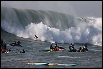 Waverunners and surfer in big wave. Half Moon Bay, California, USA (color)