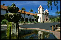 Fountain and Mission Santa Babara, mid-day. Santa Barbara, California, USA (color)