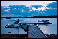 Seaplanes and dock at dusk, Ambajejus Lake. Maine, USA (color)