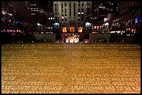 Rockefeller plaza and rink by night with Credo plaque. NYC, New York, USA ( color)