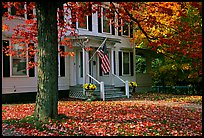 House with American flag and red leaves. Vermont, New England, USA (color)