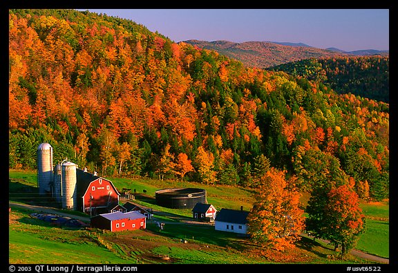 Farm surrounded by hills in fall foliage. Vermont, New England, USA (color)