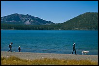 Family strolling on shore of East Lake. Newberry Volcanic National Monument, Oregon, USA (color)