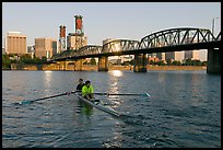 Men on double-oar shell rowing on Williamette River. Portland, Oregon, USA