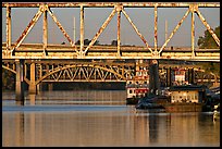 Bridges over Arkansas River, submarine and riverboats at sunrise. Little Rock, Arkansas, USA