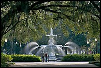 Fountain in Forsyth Park with couple standing. Savannah, Georgia, USA