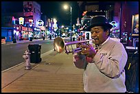 Jazz Street Musician on Beale Street by night. Memphis, Tennessee, USA (color)