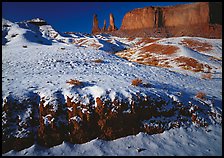 Snow on the floor, with Three Sisters in the background. Monument Valley Tribal Park, Navajo Nation, Arizona and Utah, USA ( color)